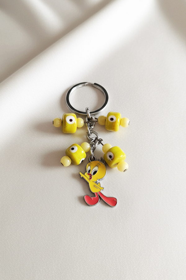 Playful Tweety Bird Keychain with Yellow Evil Eye Bead Accents