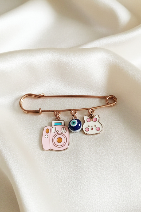 Whimsical Rose Gold Safety Pin Brooch with Camera, Bunny & Evil Eye Charms
