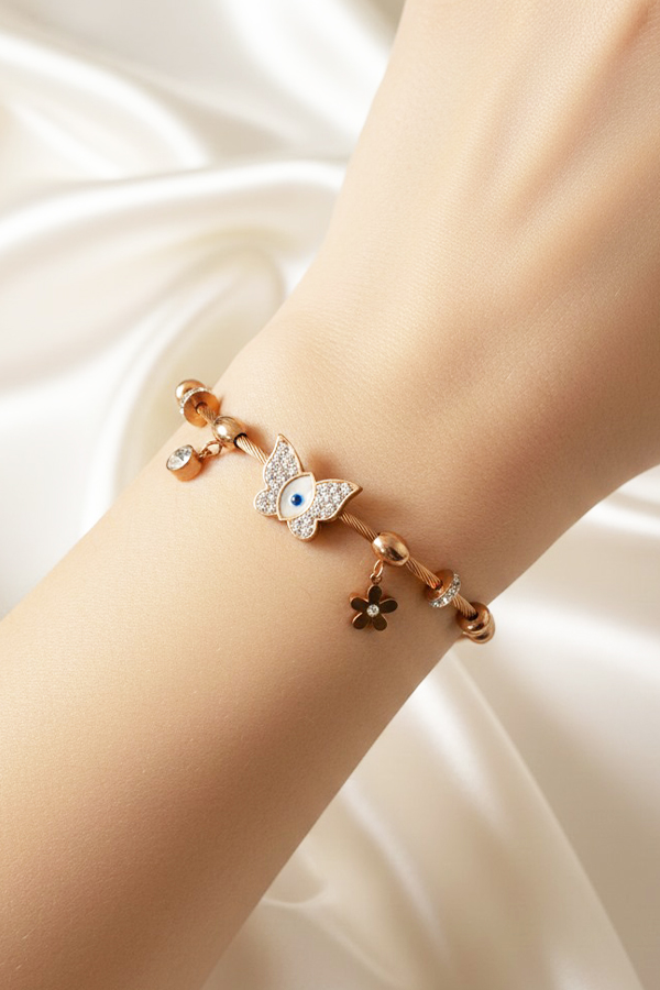 Whimsical Rose Gold Cable Bangle with Crystal Butterfly & Evil Eye