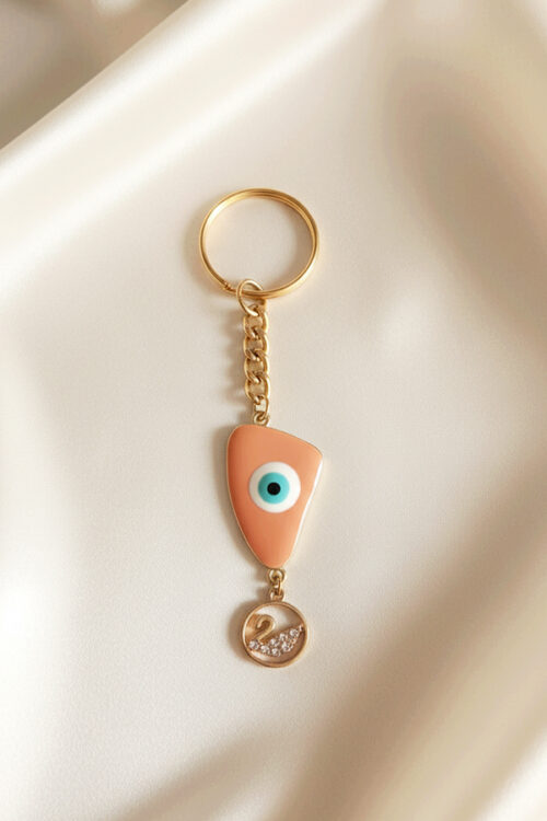 Chic Gold Evil Eye Keychain with Swan Charm in Soft Peach Enamel