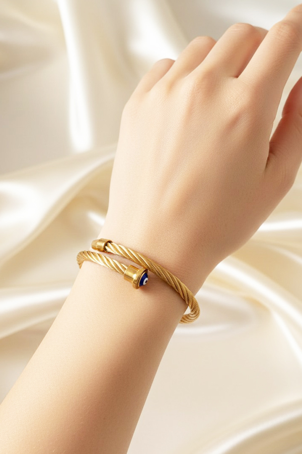 Elegant Gold Twisted Cable Cuff Bangle with Blue Evil Eye Accent