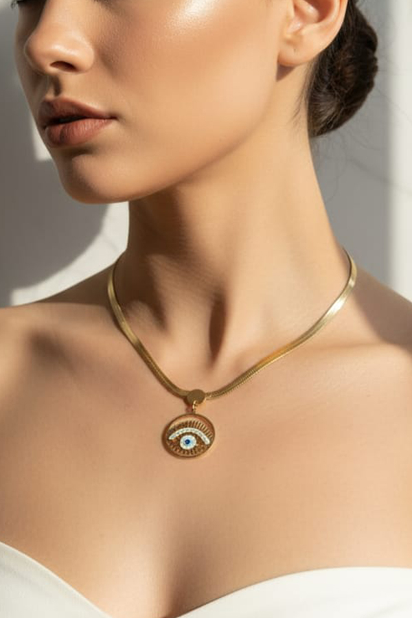 Chic Gold Snake Chain Necklace with Detailed Evil Eye Medallion
