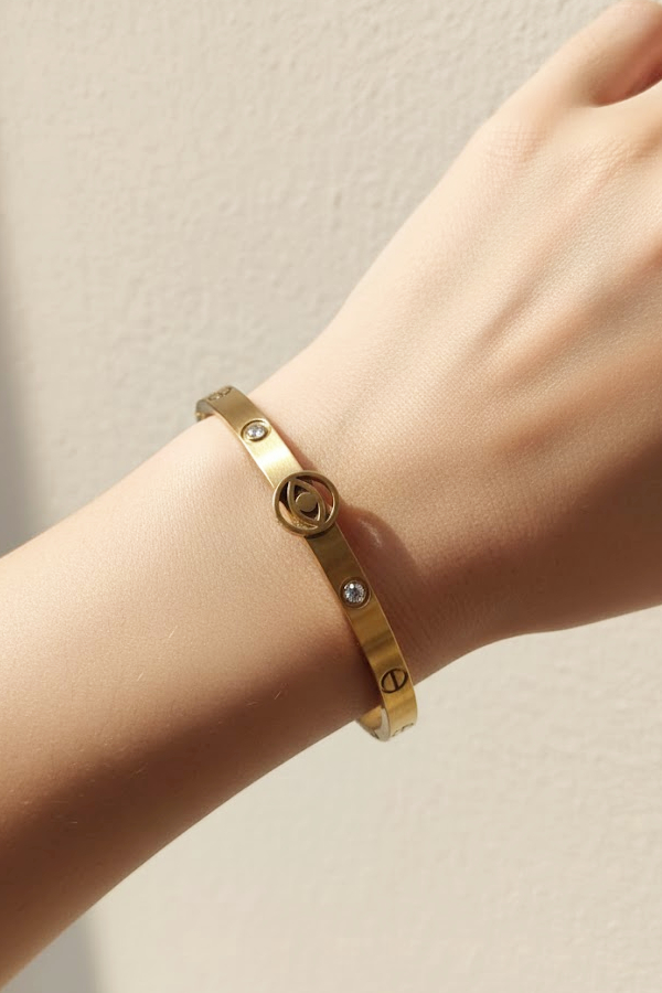 Chic Gold Bangle with Evil Eye Charm & Crystal Accents