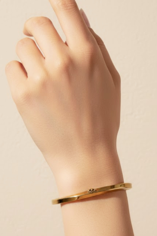 Minimalist Twisted Gold Bangle with Hidden Accent Detail