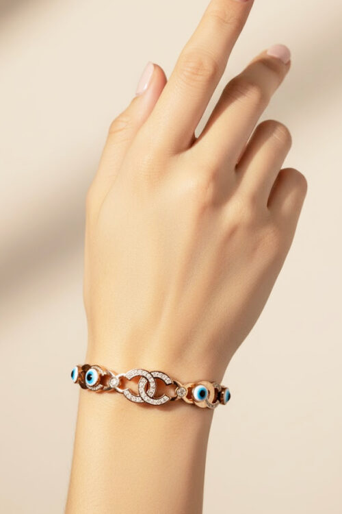 Rose Gold Interlocking Pave Bangle with Multiple Evil Eye Charms