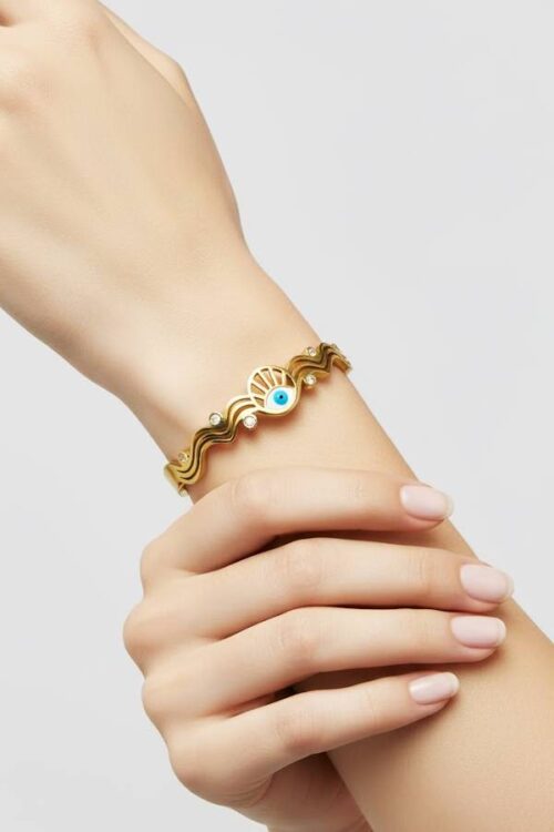 Golden Evil Eye Wave Bangle – Elegant Protection & Modern Charm