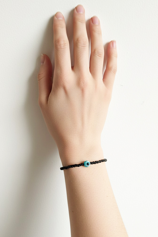 Dainty Black Seed Bead & Single Evil Eye Bracelet