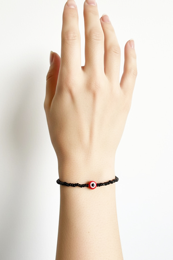 Minimalist Black Seed Bead & Red Evil Eye Bracelet